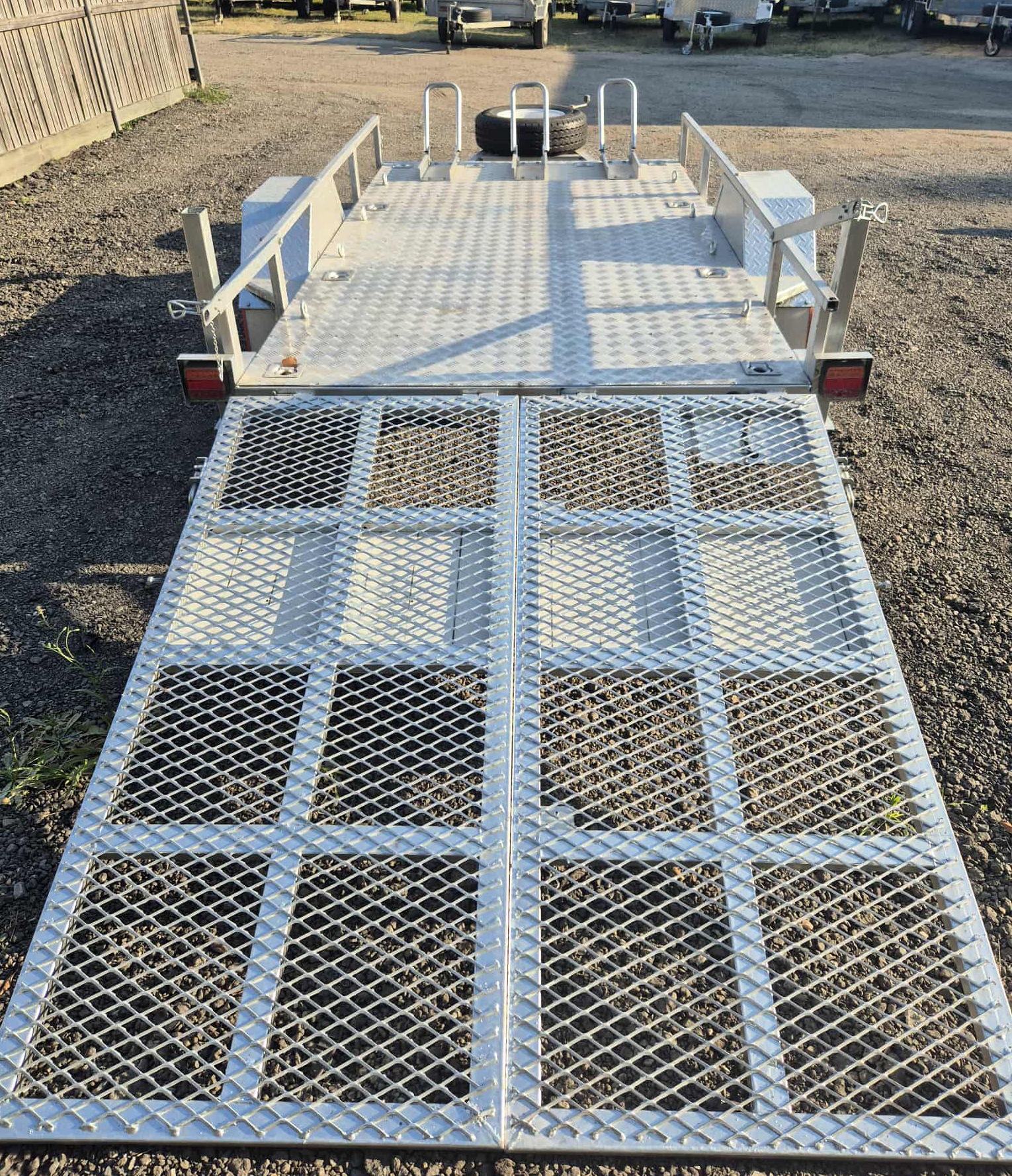 Heavy-duty motorbike trailer side view with ramp